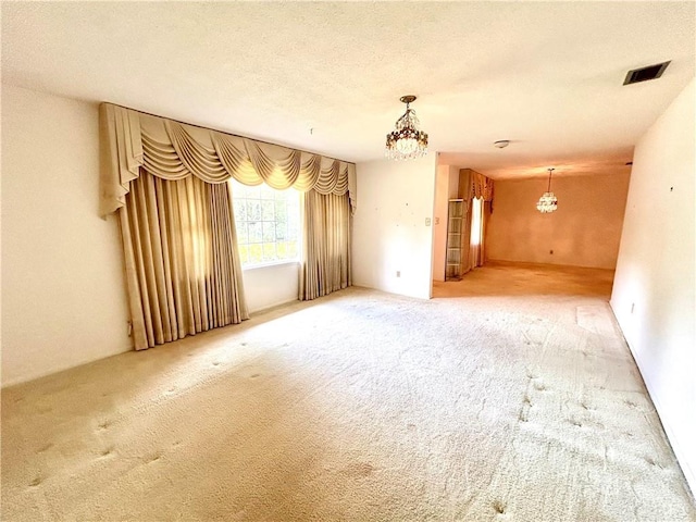 1113 Carre Dr W, Mobile, AL 36618 - carpeted spare room with a chandelier