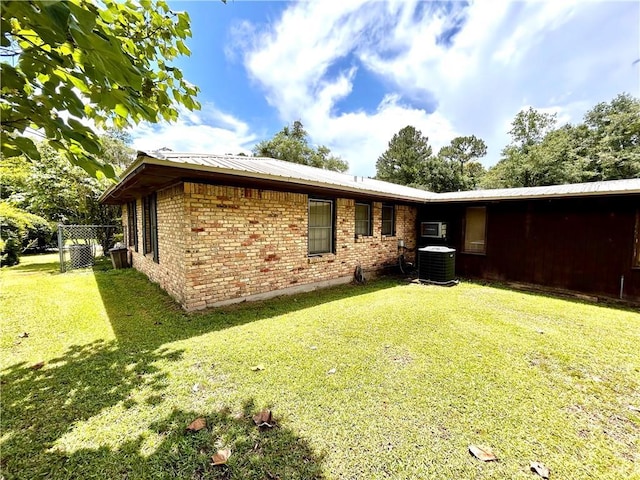 1113 Carre Dr W, Mobile, AL 36618 - rear view of property with a metal roof and brick siding
