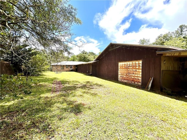 1113 Carre Dr W, Mobile, AL 36618 - view of green lawn featuring a garage