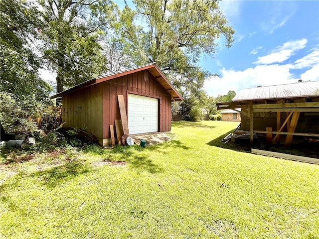 1113 Carre Dr W, Mobile, AL 36618 - view of green lawn with a detached garage and an outbuilding
