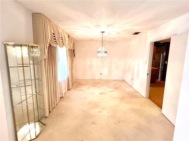 1113 Carre Dr W, Mobile, AL 36618 - unfurnished dining area featuring carpet flooring and a chandelier