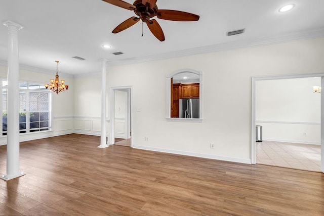 8705 Floyd Crabtree Way, Semmes, AL 36575 - unfurnished living room with decorative columns, crown molding, a ceiling fan, a chandelier, and recessed lighting