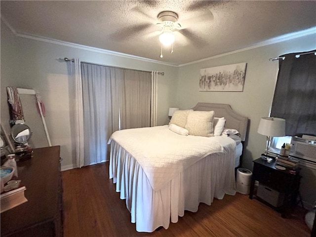 bedroom featuring dark hardwood / wood-style floors, ornamental molding, a textured ceiling, and ceiling fan