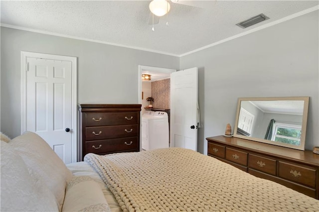 bedroom with ornamental molding, ceiling fan, separate washer and dryer, and a textured ceiling