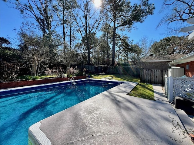 view of pool featuring a patio area, a fenced backyard, and a fenced in pool