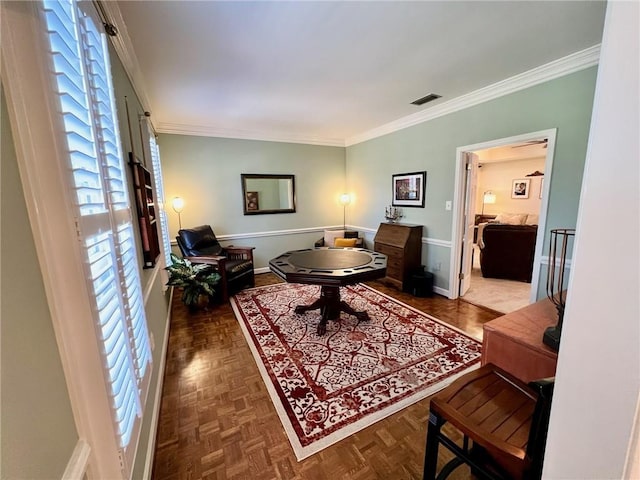 interior space featuring ornamental molding, visible vents, and baseboards