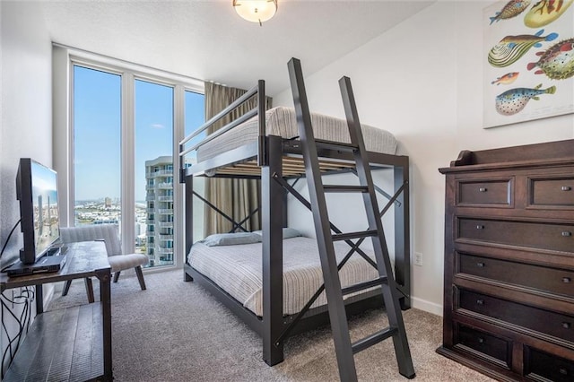 carpeted bedroom with lofted ceiling