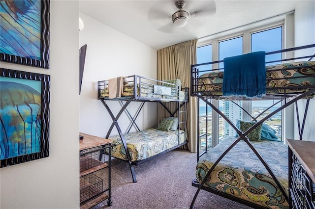 bedroom with ceiling fan and carpet