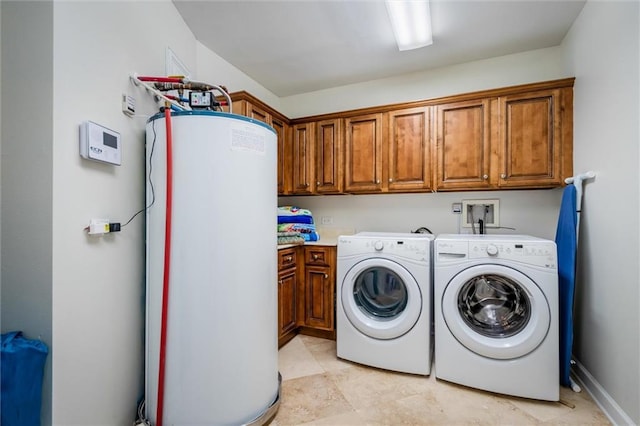 washroom featuring light tile floors, cabinets, washer and dryer, washer hookup, and water heater