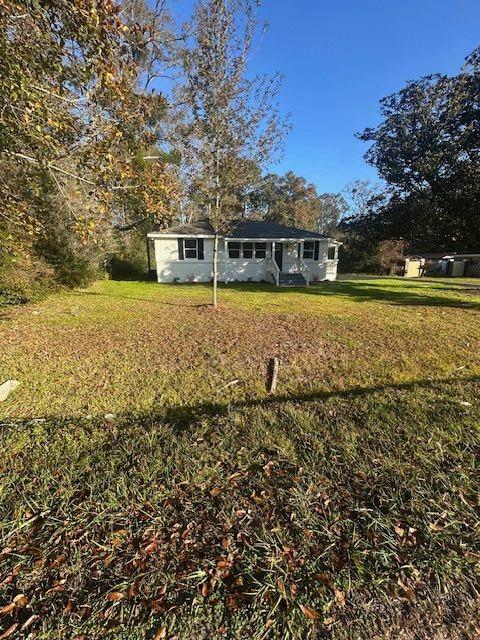 view of front of property with a front lawn