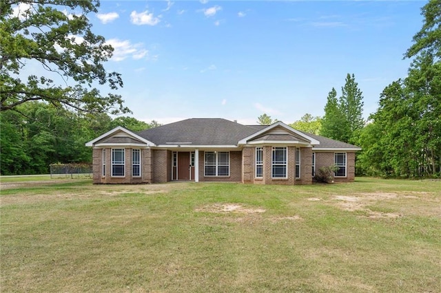 single story home with brick siding and a front lawn