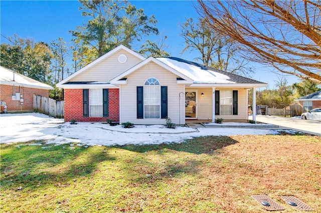 ranch-style home with a front lawn