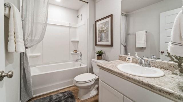 full bathroom featuring vanity, shower / bathtub combination, and toilet