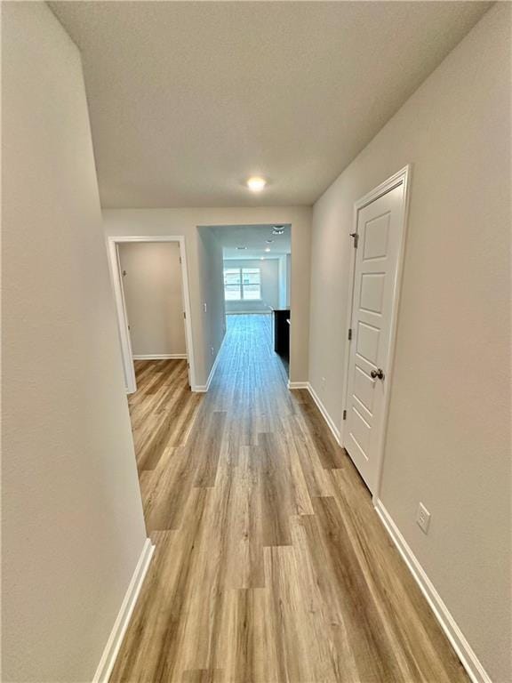 hallway featuring light hardwood / wood-style floors