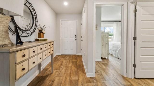 doorway to outside with light wood-type flooring