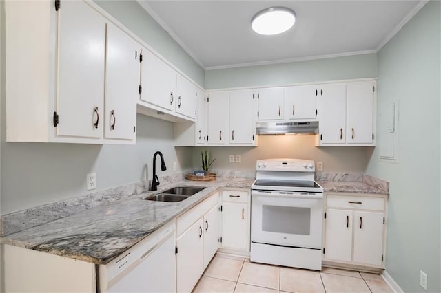 kitchen with light tile patterned floors, under cabinet range hood, white appliances, a sink, and white cabinetry