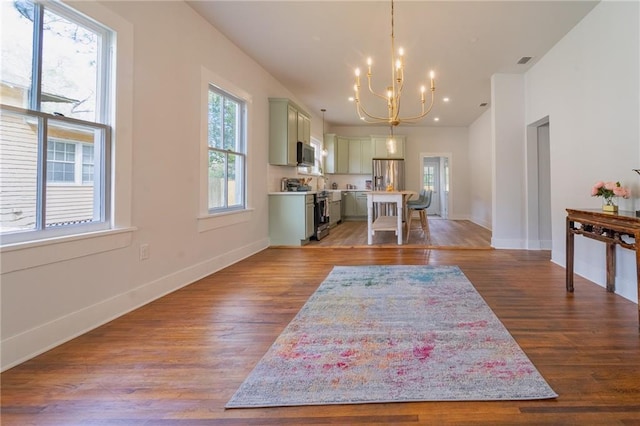 kitchen featuring visible vents, appliances with stainless steel finishes, wood finished floors, and light countertops