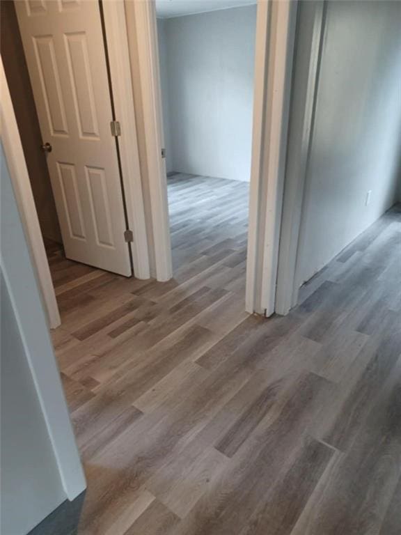 corridor featuring wood finished floors