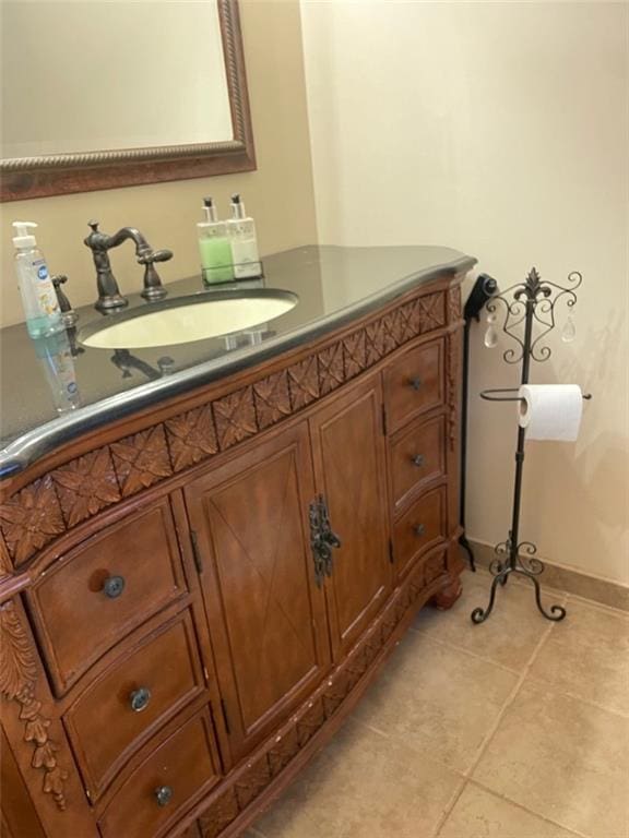 bathroom featuring tile patterned flooring and vanity