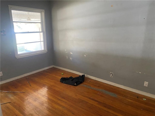 spare room featuring hardwood / wood-style flooring