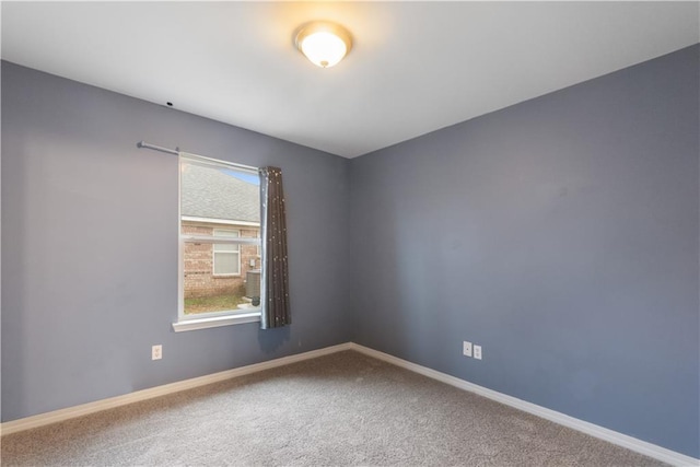 spare room featuring carpet floors