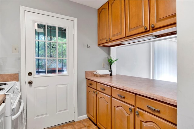 doorway with light tile patterned floors