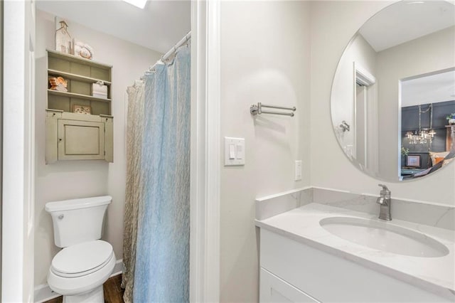 bathroom featuring vanity and toilet