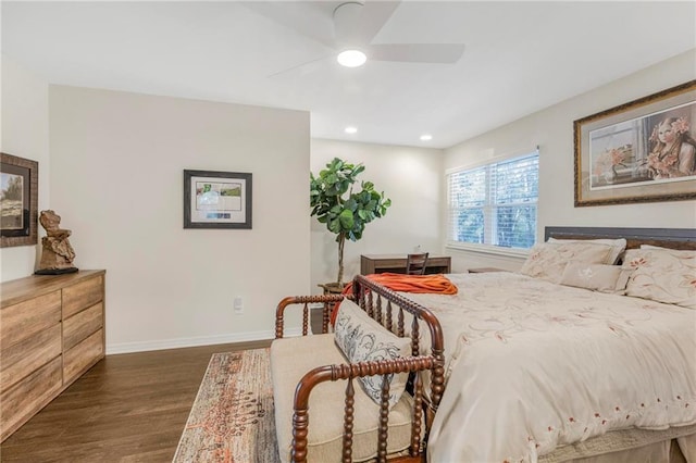 bedroom with dark hardwood / wood-style floors and ceiling fan