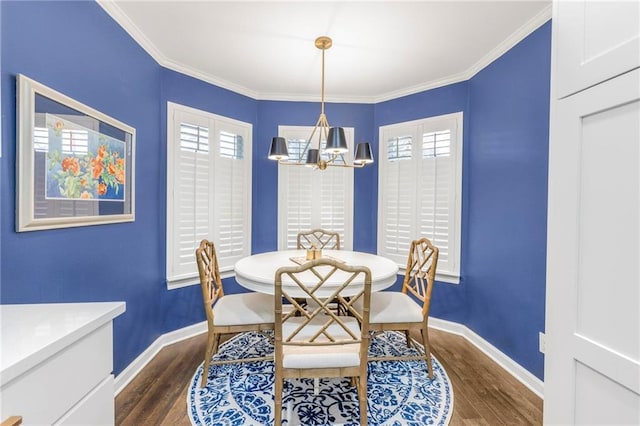 dining room featuring crown molding, a chandelier, and dark hardwood / wood-style flooring