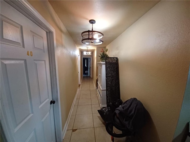 corridor with light tile patterned floors