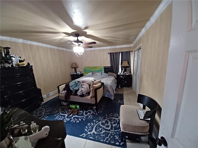 bedroom with ceiling fan, tile patterned floors, and crown molding