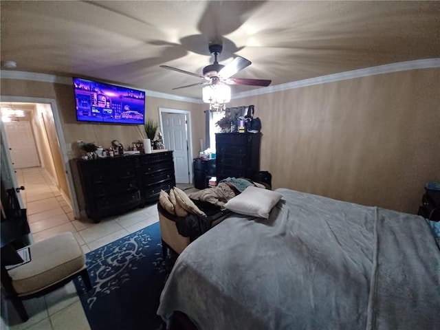 tiled bedroom featuring ornamental molding and ceiling fan