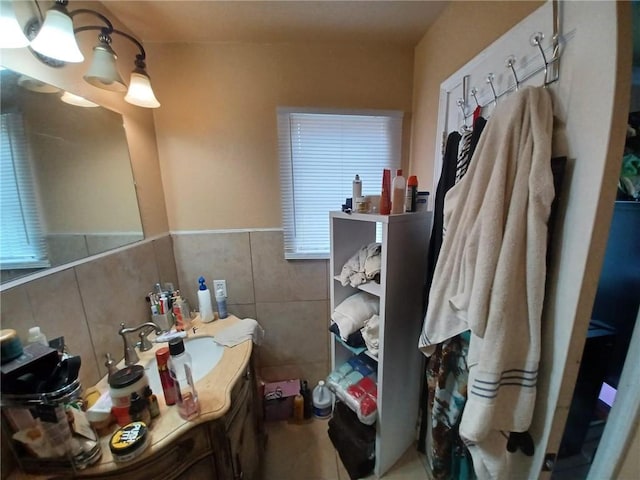 bathroom with tile walls and vanity