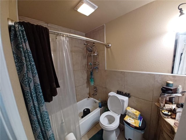 bathroom with shower / tub combo with curtain, tile walls, and toilet