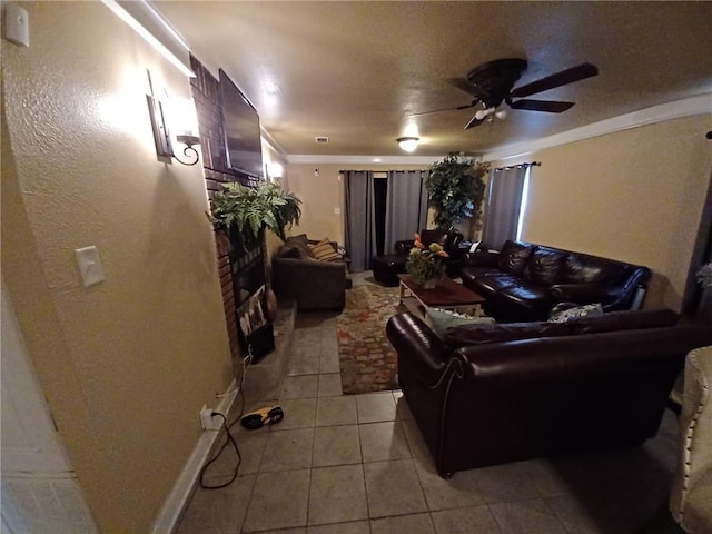 tiled living room featuring ceiling fan and ornamental molding