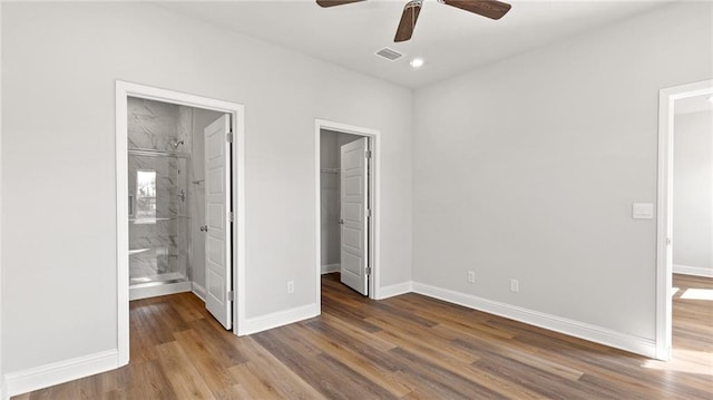 1269 Legacy Rd, Mobile, AL 36608 - unfurnished bedroom featuring a walk in closet, wood finished floors, a closet, recessed lighting, and ensuite bathroom