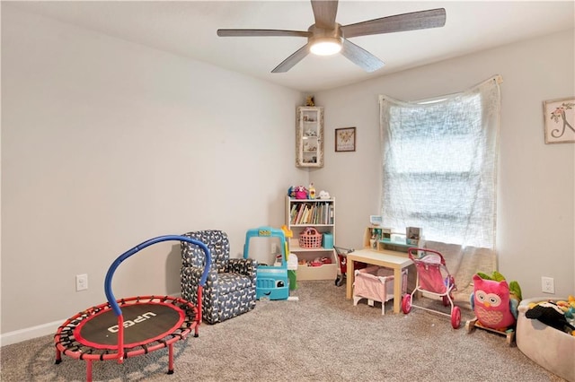 recreation room featuring ceiling fan and carpet floors