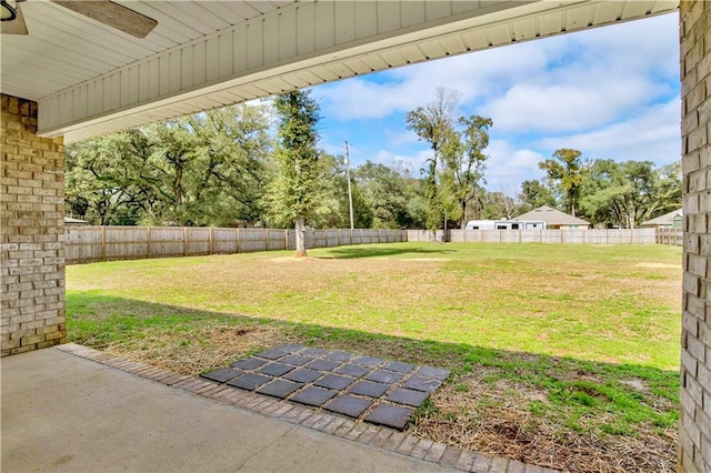 view of yard featuring a patio area and a fenced backyard