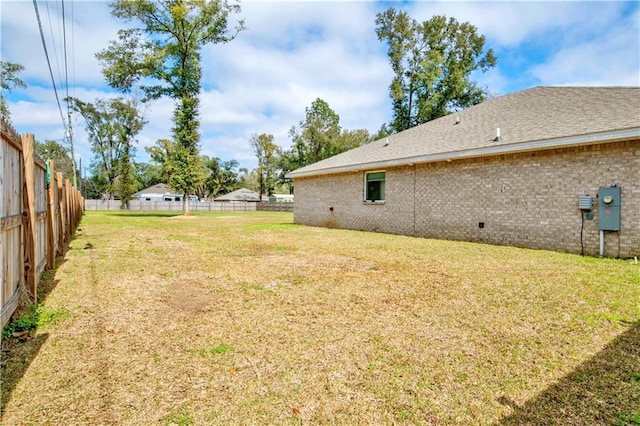 view of yard featuring fence