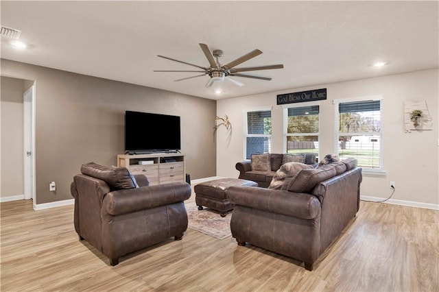 living area with recessed lighting, visible vents, a ceiling fan, light wood-type flooring, and baseboards