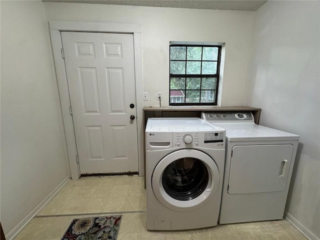 9740 Tanner Williams Rd, Mobile, AL 36608 - laundry room with independent washer and dryer and baseboards