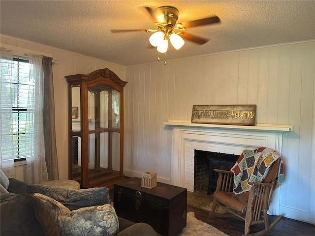 9740 Tanner Williams Rd, Mobile, AL 36608 - living area featuring a textured ceiling, ceiling fan, plenty of natural light, and a fireplace