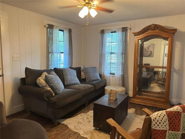 9740 Tanner Williams Rd, Mobile, AL 36608 - living room with wood finished floors, ceiling fan, and a textured ceiling