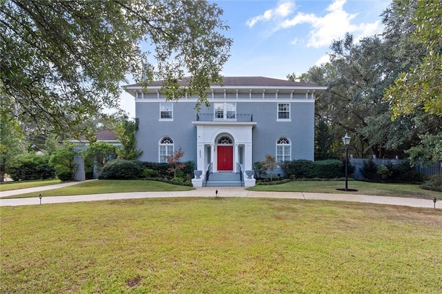 italianate-style house with a front lawn