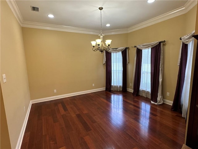 spare room with hardwood / wood-style flooring, a notable chandelier, and ornamental molding