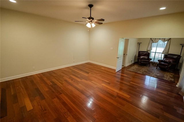 unfurnished living room featuring hardwood / wood-style flooring and ceiling fan