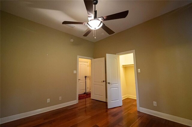 unfurnished bedroom with hardwood / wood-style flooring and ceiling fan