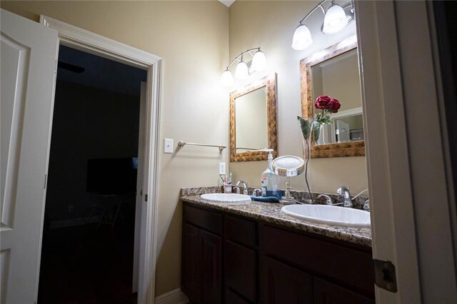 bathroom featuring double vanity