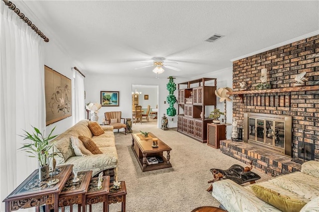 living area with visible vents, a brick fireplace, carpet flooring, ceiling fan, and a textured ceiling