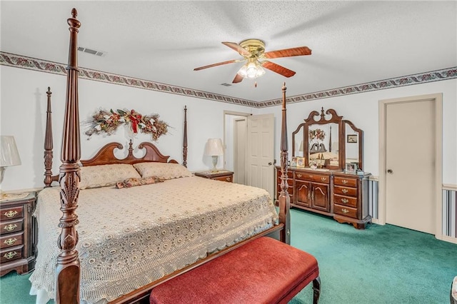 bedroom with a textured ceiling, ceiling fan, carpet, and visible vents